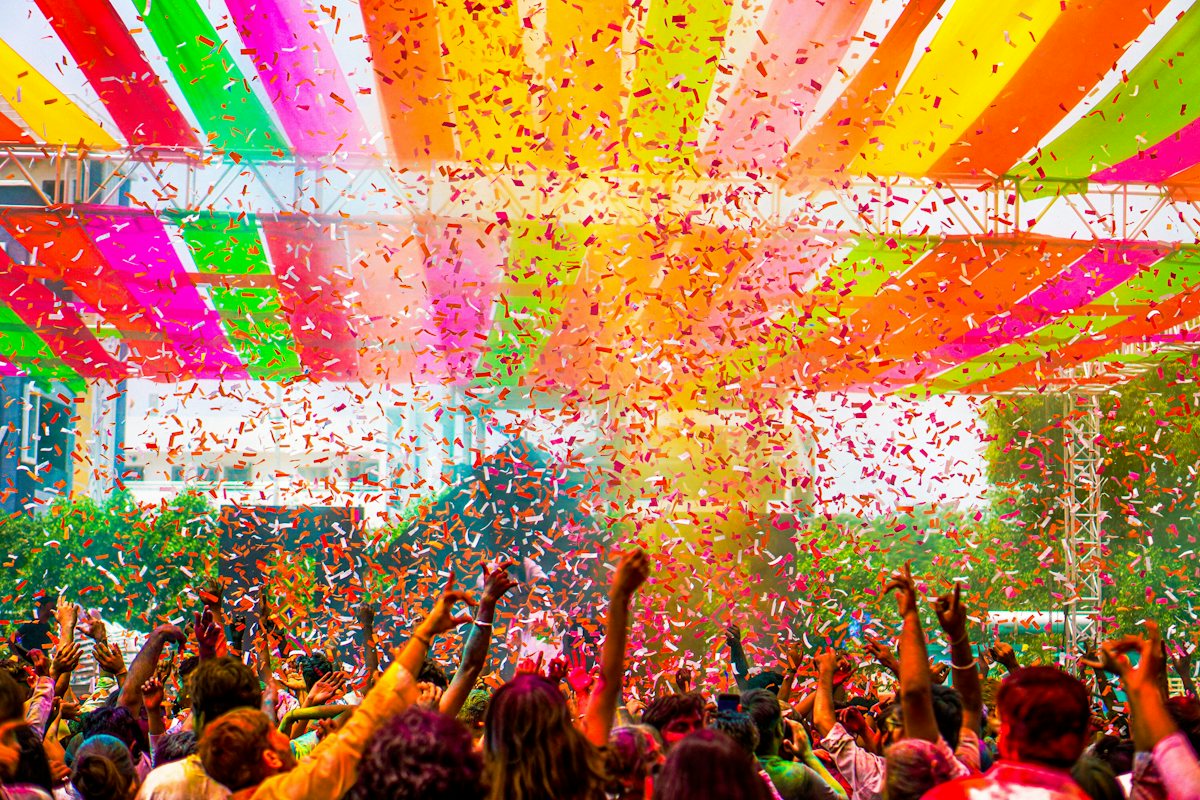 Members gathered under a festival canopy