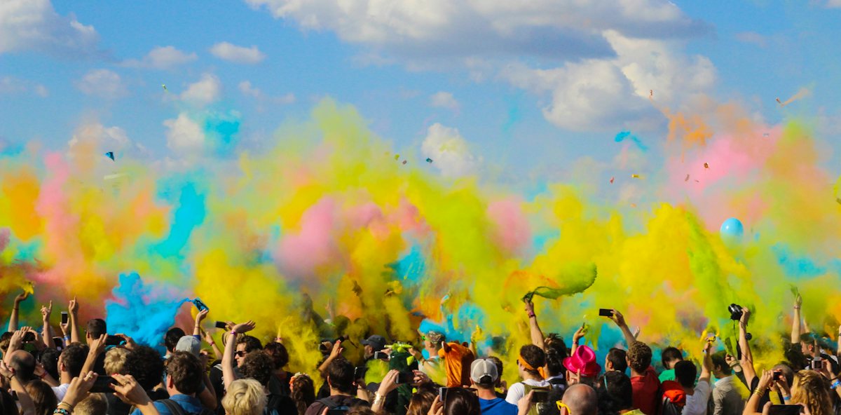 Clouds of festival colour over a crowd